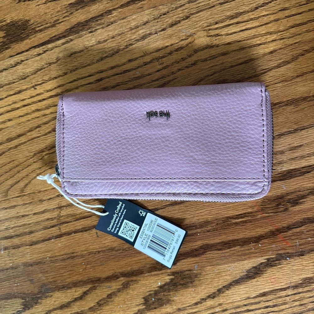 The Sak Pink Wallet with Smooth Finish and Organized Interior